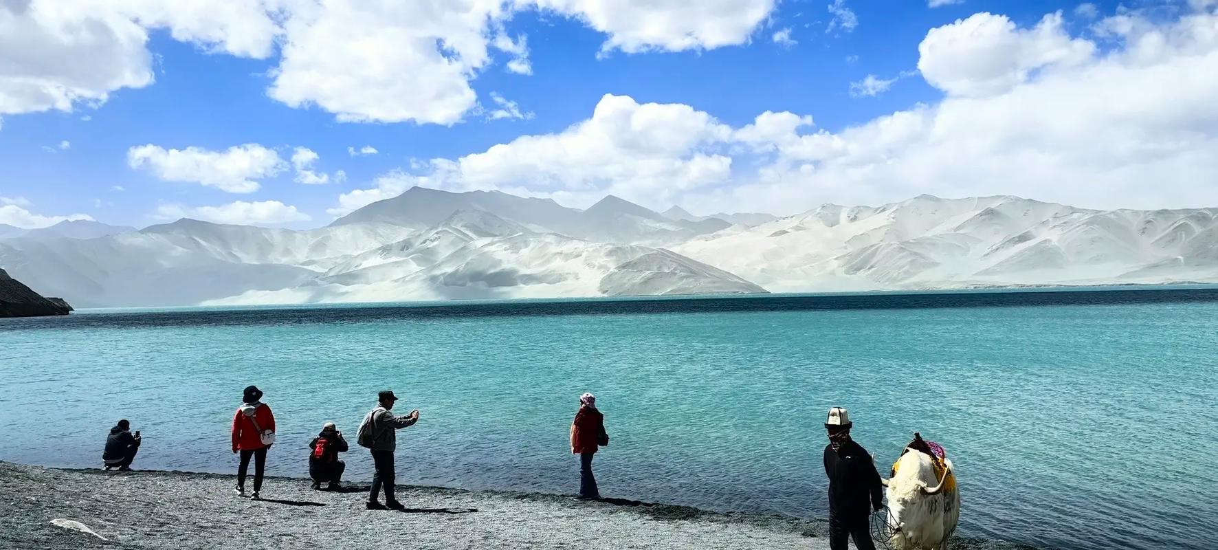 Calm Altai region lake ringed by trees in northern Xinjiang