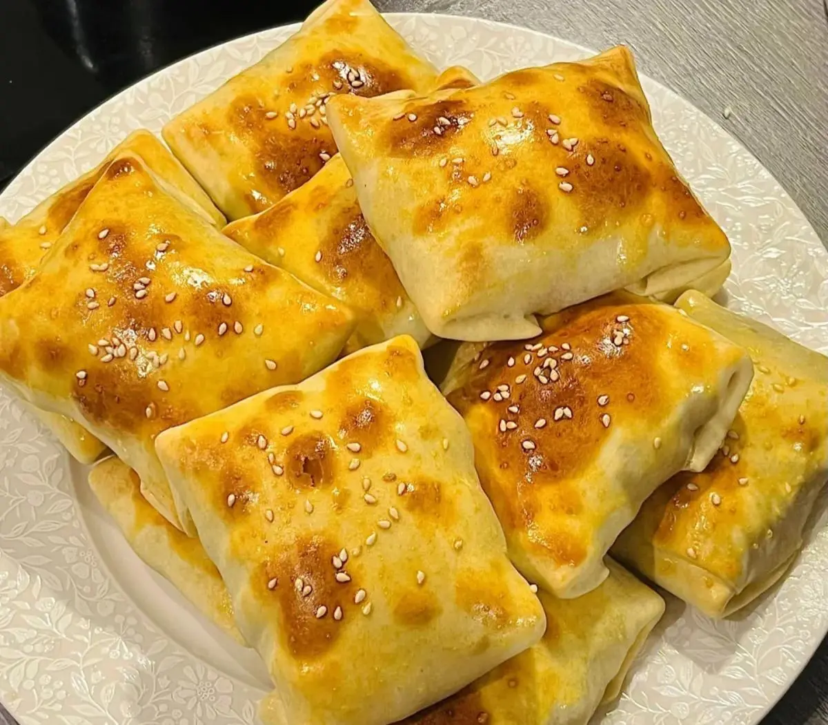 Xinjiang roast buns (samsa) at a night market food stall