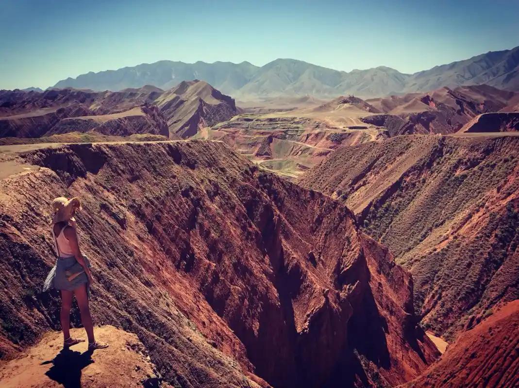 Red rock canyon walls in southern Xinjiang, similar to the folded gorges of the Kalpintag range