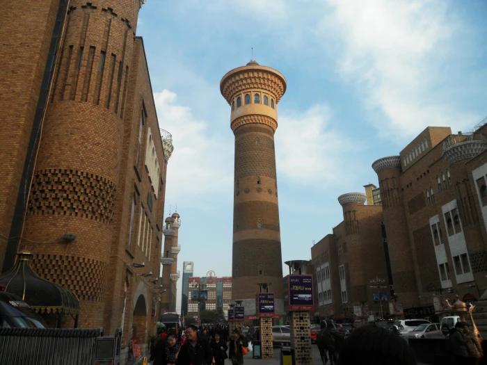 Xinjiang market scene with shoppers and food vendors
