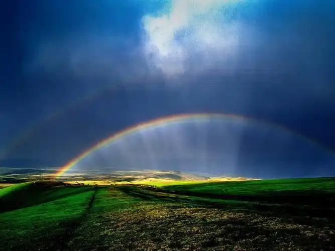 Rainbow over the valley landscape near Wenquan county, Bortala, Xinjiang